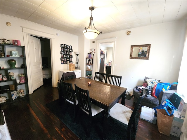 dining room with dark wood-type flooring