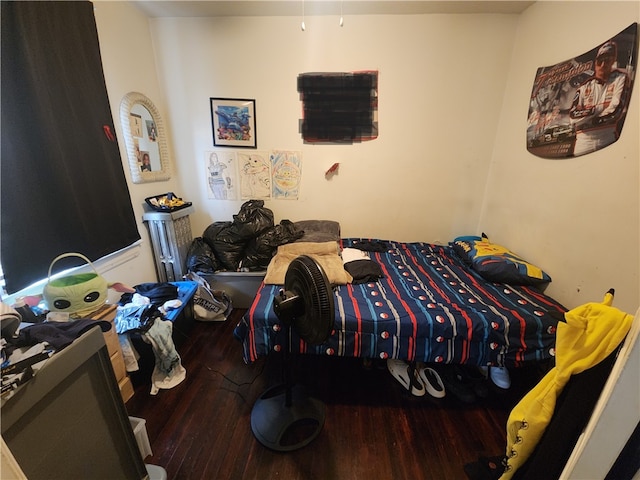 bedroom featuring hardwood / wood-style flooring