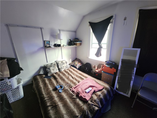 carpeted bedroom featuring vaulted ceiling