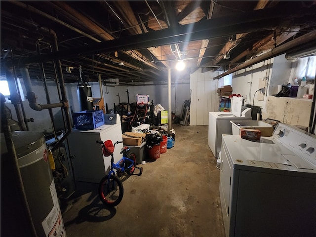 basement with separate washer and dryer and water heater