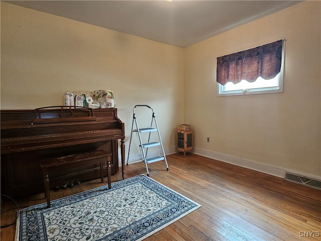 miscellaneous room featuring hardwood / wood-style flooring