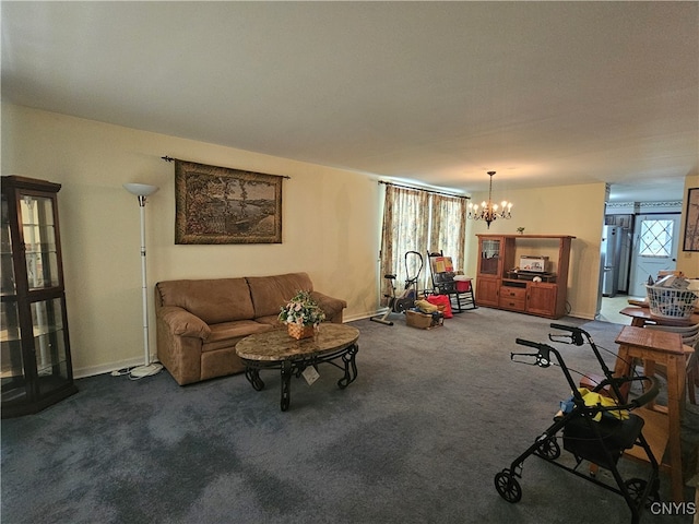 living room with carpet floors and an inviting chandelier