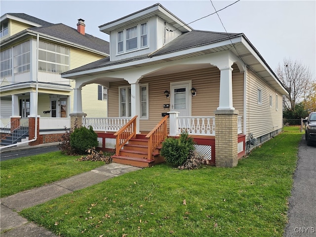 view of front of house featuring a porch and a front lawn