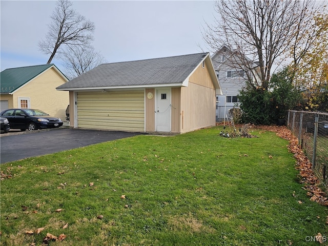 garage featuring a lawn