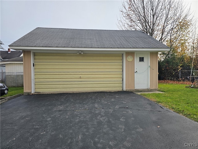 garage with a yard