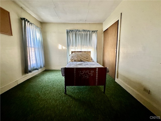 carpeted bedroom featuring a closet