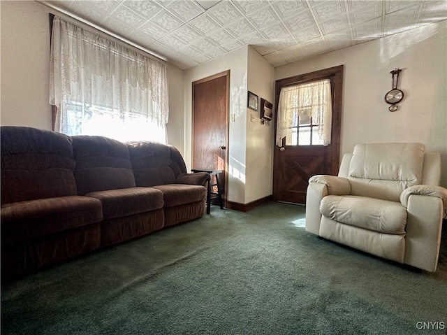 living room with dark colored carpet