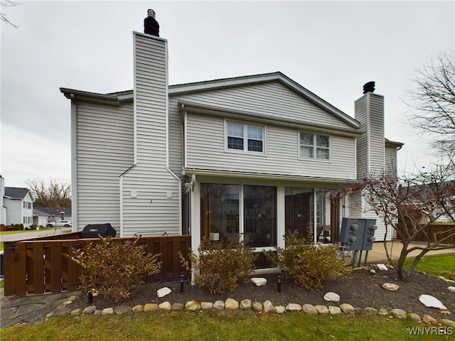 back of property featuring a sunroom