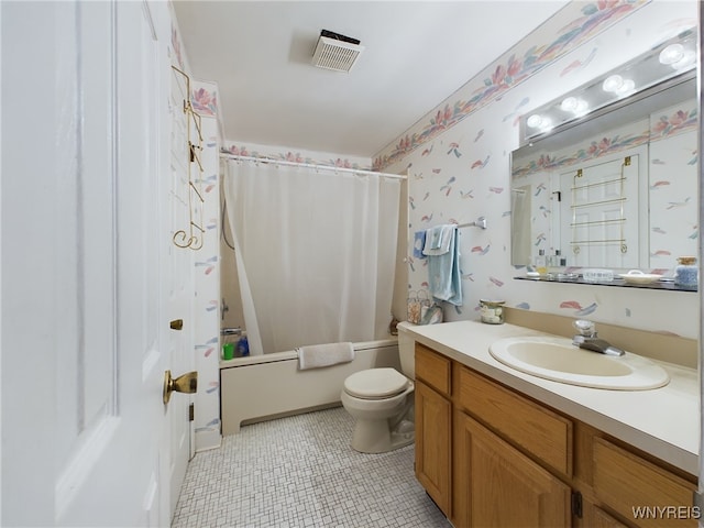 full bathroom featuring tile patterned flooring, shower / tub combo, vanity, and toilet