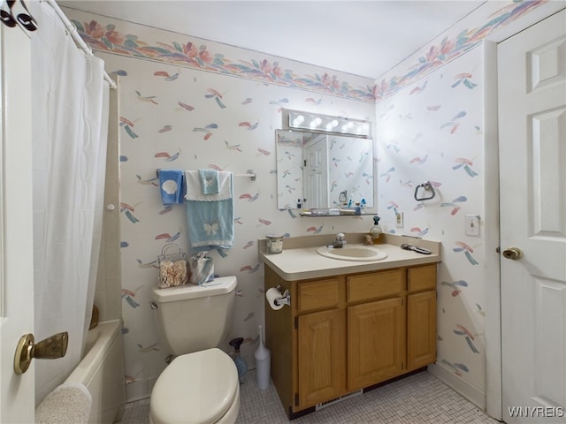 full bathroom featuring tile patterned floors, shower / bathtub combination with curtain, vanity, and toilet