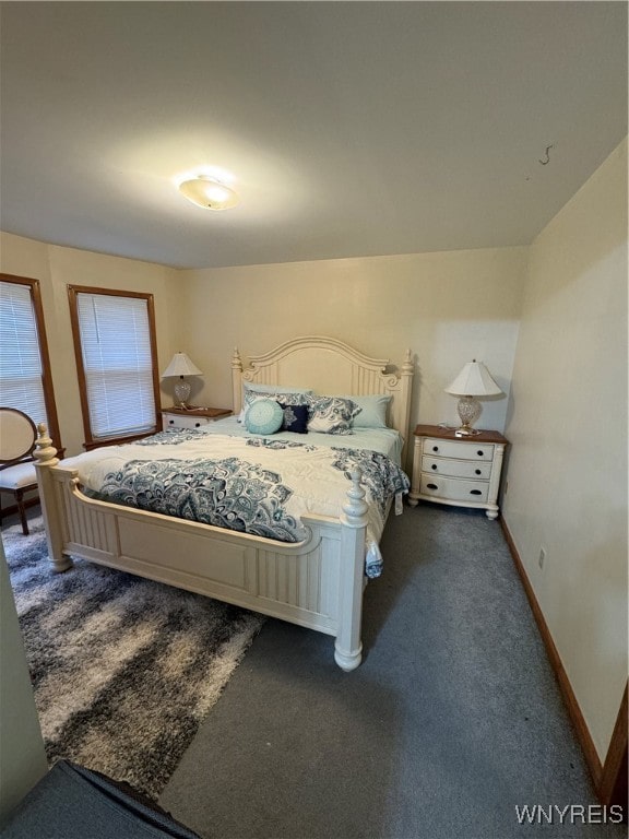 bedroom with dark carpet