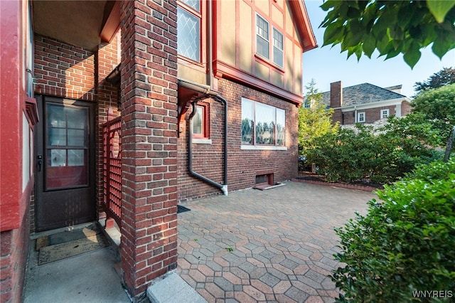 view of side of home featuring a patio area