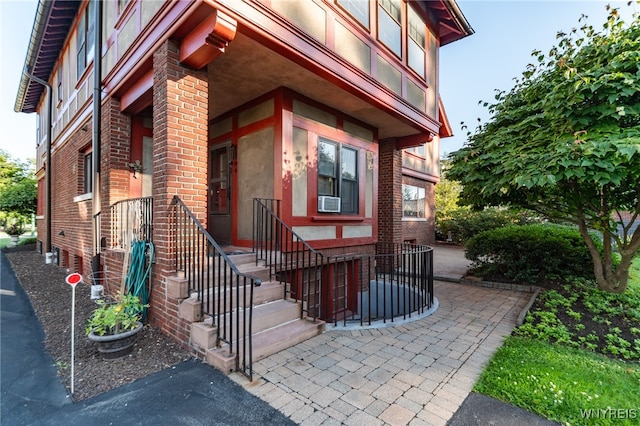 doorway to property featuring cooling unit