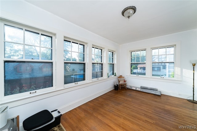 unfurnished sunroom featuring plenty of natural light