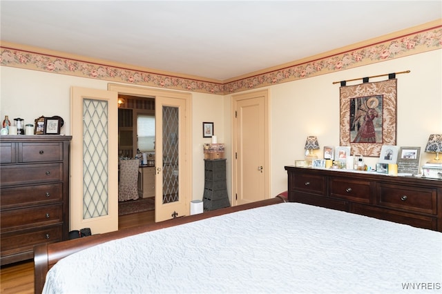 bedroom with hardwood / wood-style floors