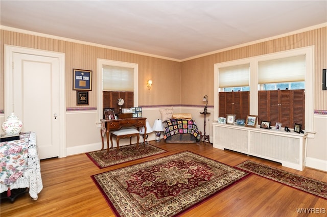 interior space with crown molding and light wood-type flooring