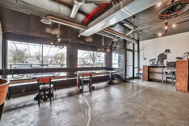 misc room with plenty of natural light and concrete flooring