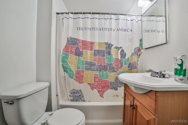 full bathroom featuring shower / bath combination with curtain, vanity, and toilet