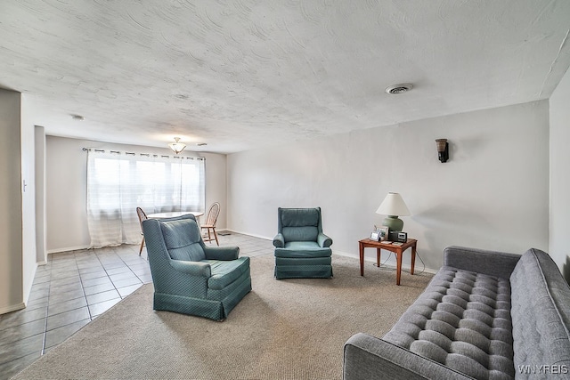 living room featuring carpet flooring and a textured ceiling