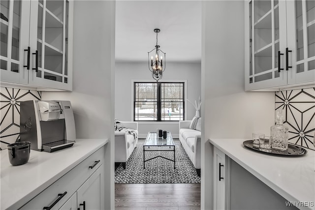 interior space featuring a chandelier and dark hardwood / wood-style floors