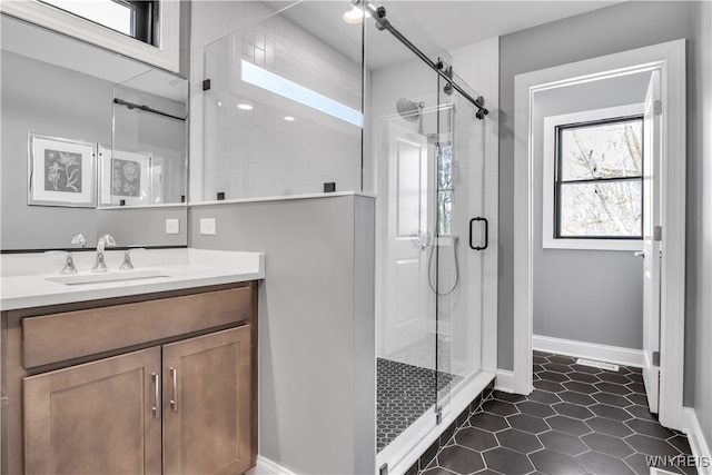 bathroom with vanity, tile patterned floors, and walk in shower