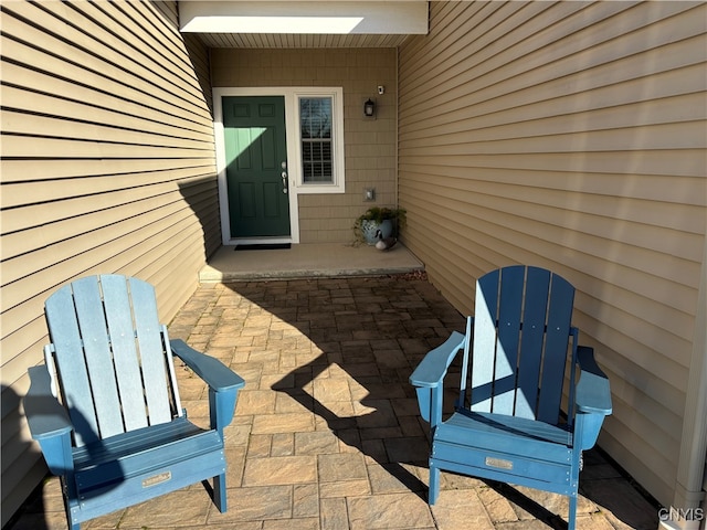 entrance to property featuring a patio area