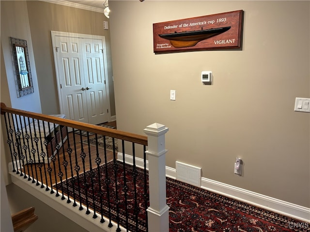 stairs featuring ornamental molding