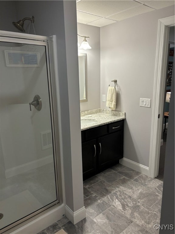 bathroom featuring vanity and a shower with door