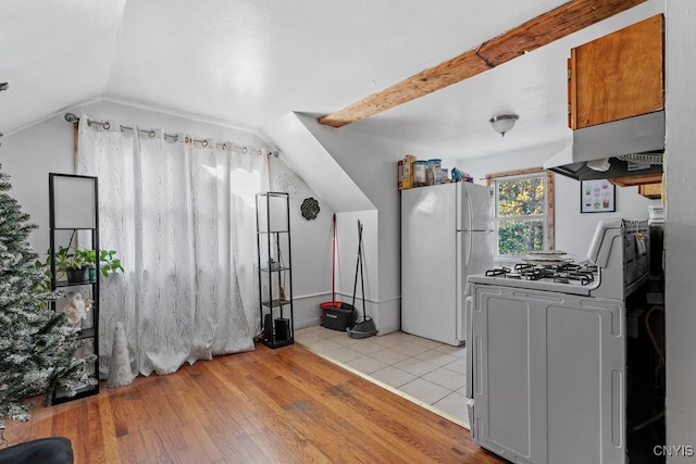 kitchen with light hardwood / wood-style flooring, ventilation hood, white fridge, lofted ceiling, and range