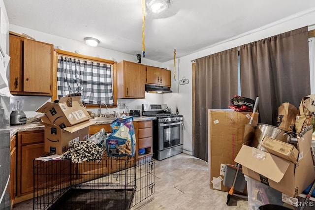 kitchen with stainless steel gas stove and sink