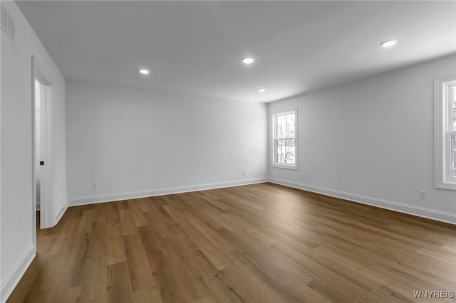 unfurnished room featuring wood-type flooring