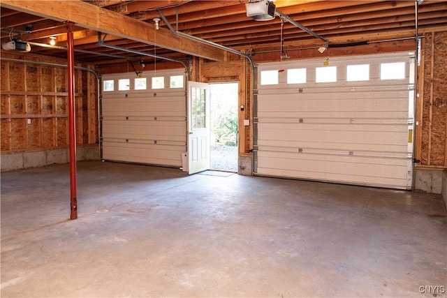 garage with a carport and a garage door opener