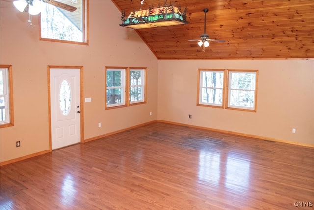 entrance foyer featuring wood-type flooring, vaulted ceiling, a wealth of natural light, and wood ceiling