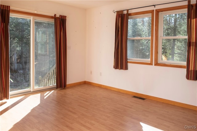 empty room with light hardwood / wood-style floors