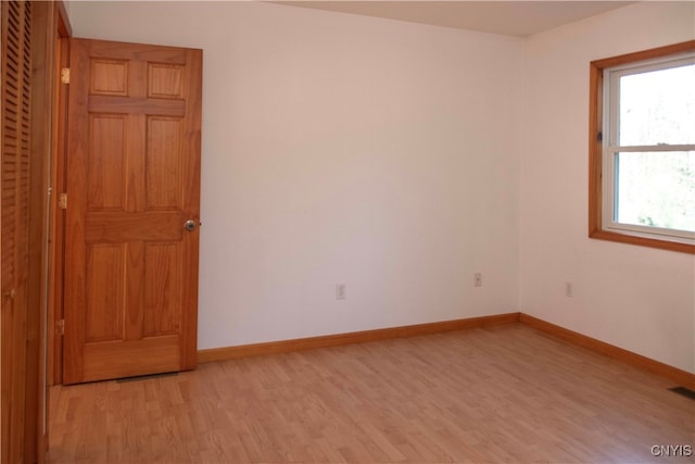 spare room featuring light hardwood / wood-style flooring