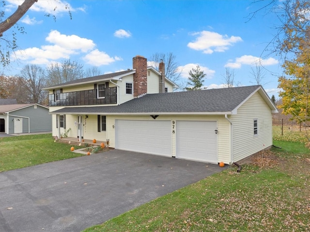 front facade with a porch, a garage, and a front lawn