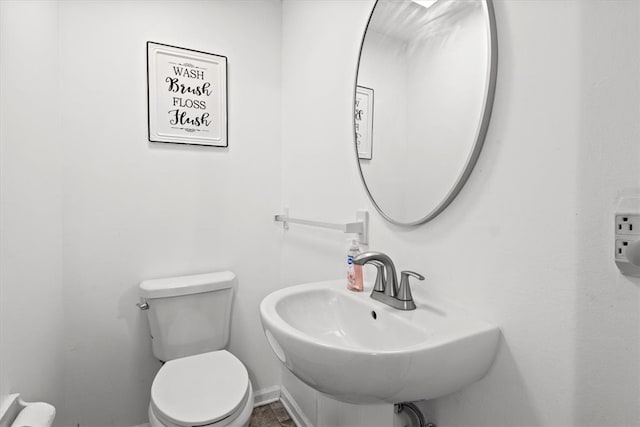 bathroom with toilet and sink