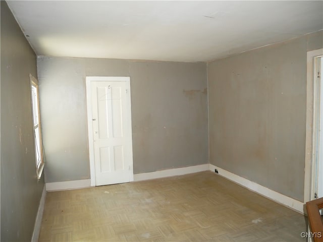 unfurnished room featuring light parquet floors