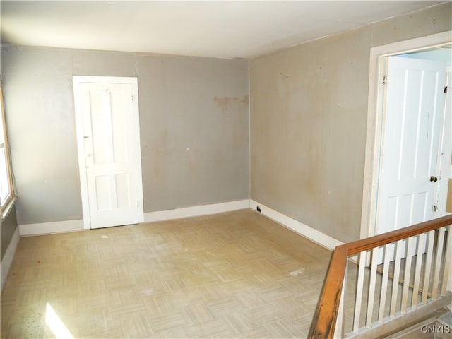 empty room with light parquet floors