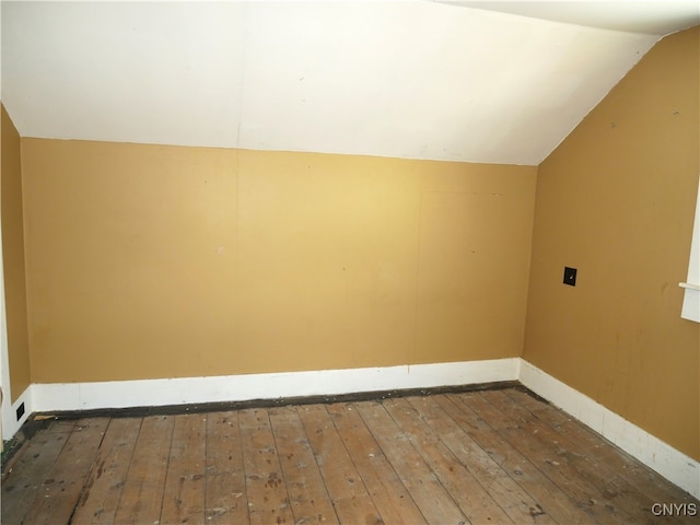 bonus room featuring dark hardwood / wood-style floors and lofted ceiling