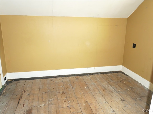 empty room with hardwood / wood-style flooring