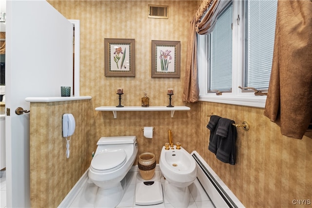 bathroom featuring tile patterned flooring, a bidet, a baseboard radiator, and toilet