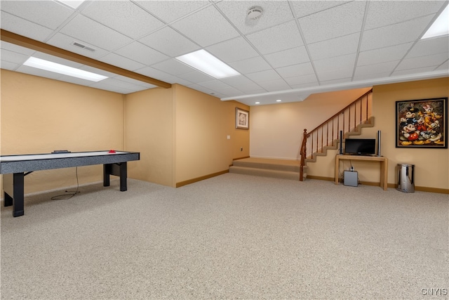 playroom with carpet flooring and a paneled ceiling