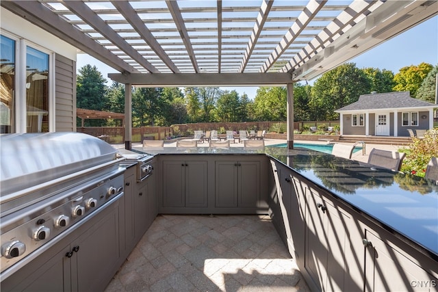 view of patio / terrace featuring an outdoor structure, area for grilling, a pergola, and grilling area