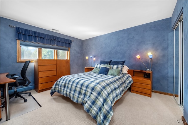 bedroom featuring light carpet