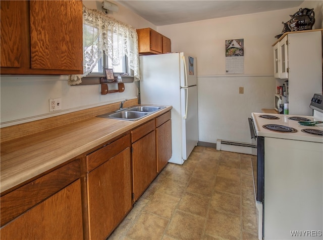 kitchen with sink, white appliances, and a baseboard heating unit