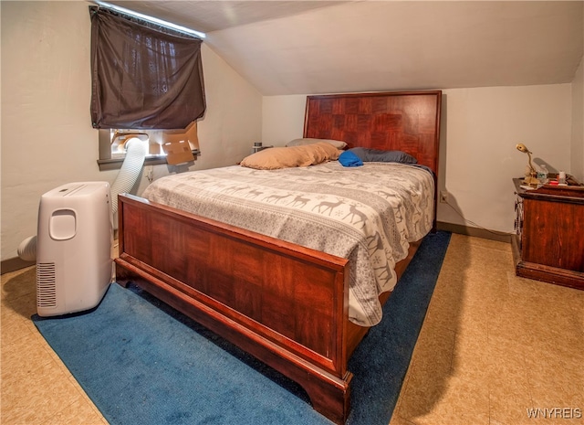 bedroom featuring vaulted ceiling