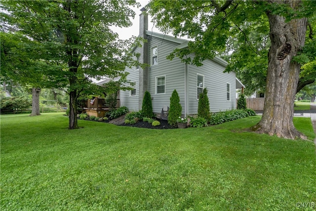 view of property exterior featuring a lawn