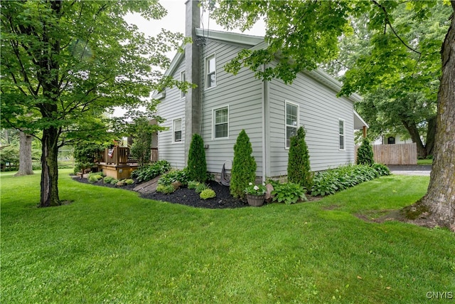 view of side of property featuring a yard