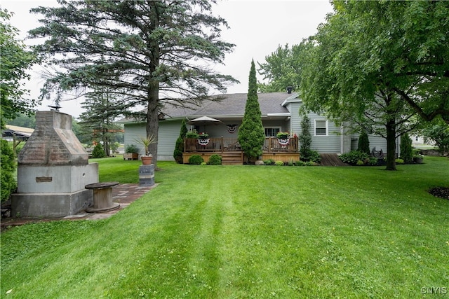 view of yard with a wooden deck